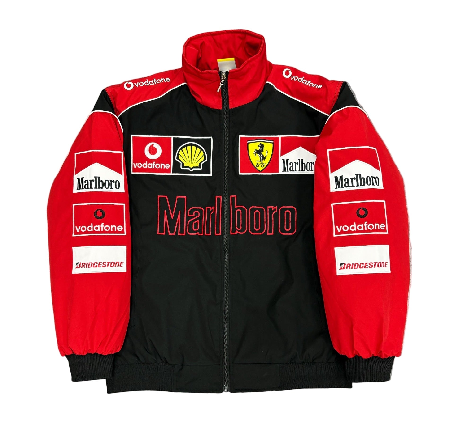 Black and red jacket with various sponsor logos on a gray surface