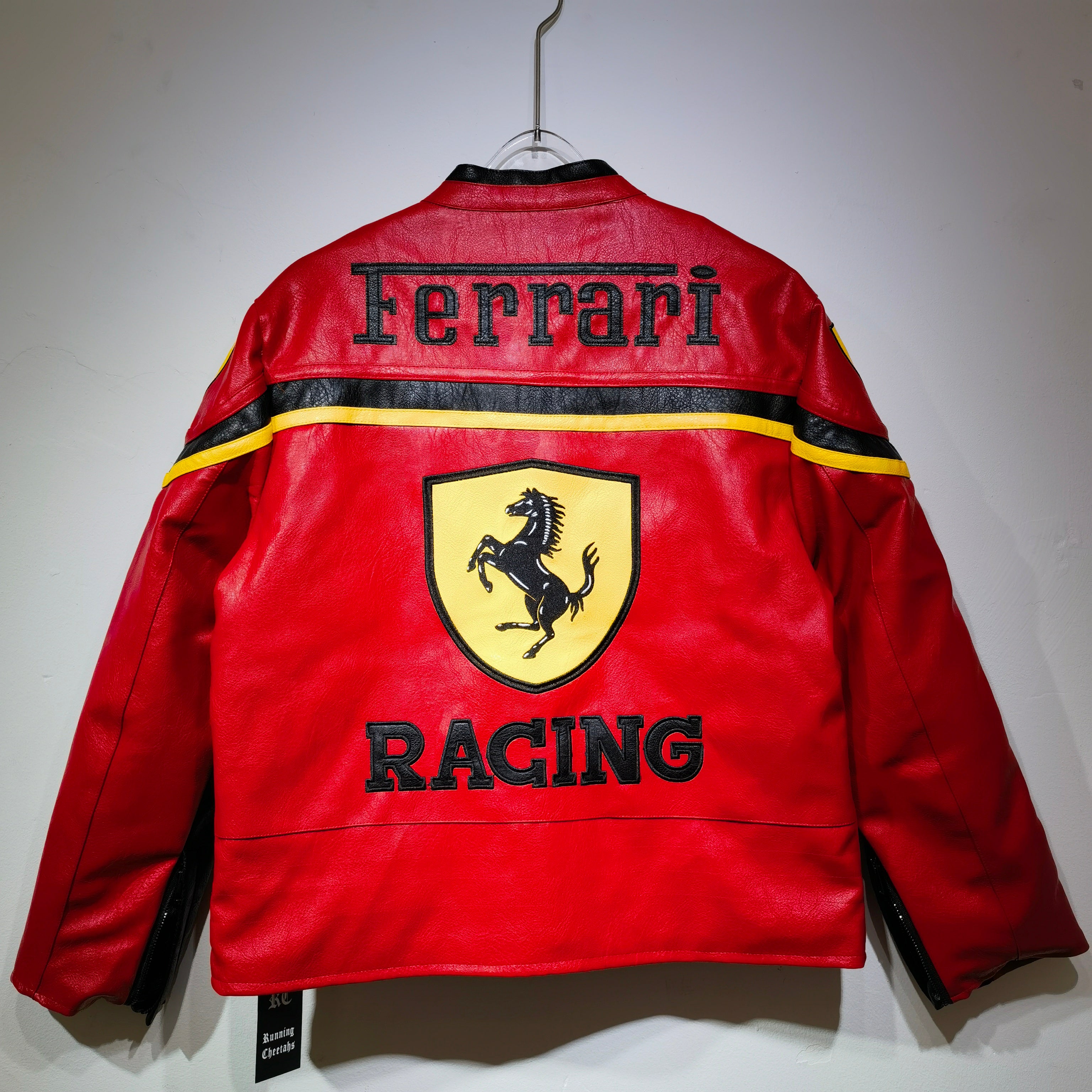 Red Ferrari racing jacket with logo on a white background