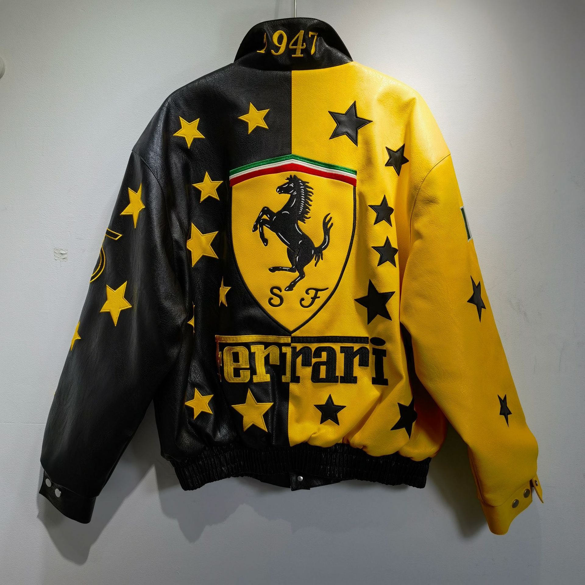 Yellow and black Ferrari jacket with star patterns on a white background