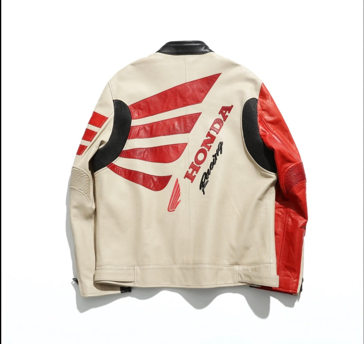 Beige and red motorcycle jacket with Honda Racing logo on a white background