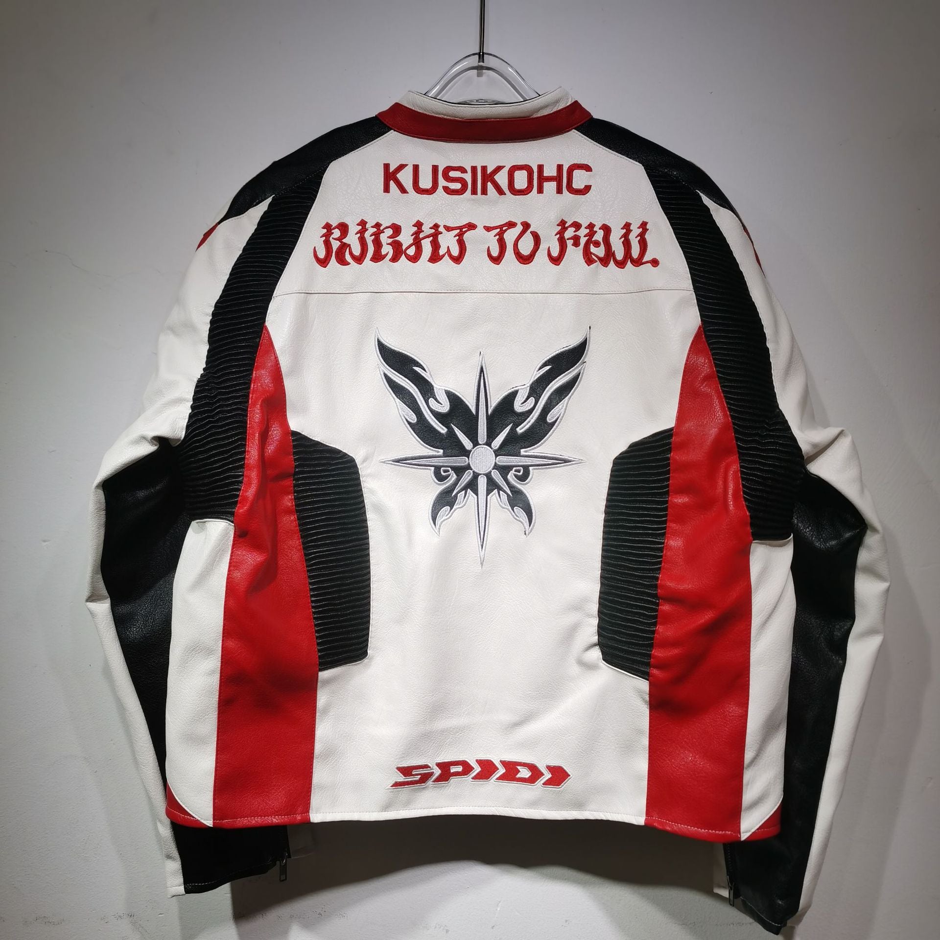 White jacket with red and black accents, featuring branding and graphics on a gray background