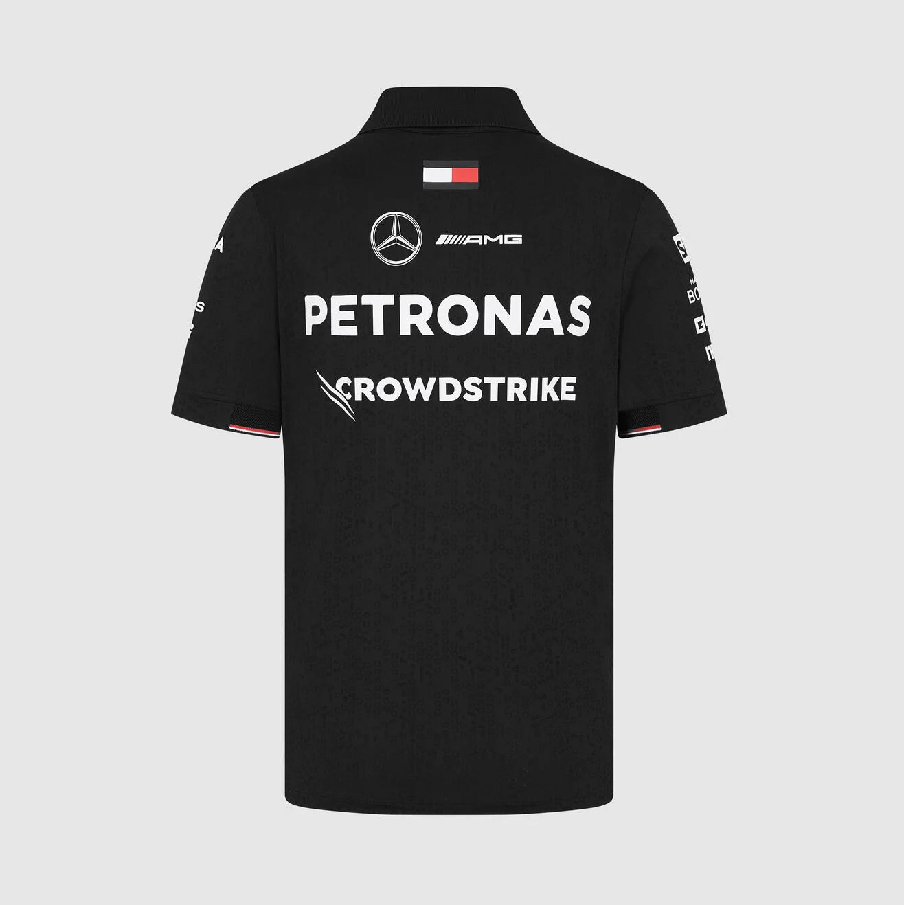 Black polo shirt with Mercedes-Benz and Petronas logos on a light gray background
