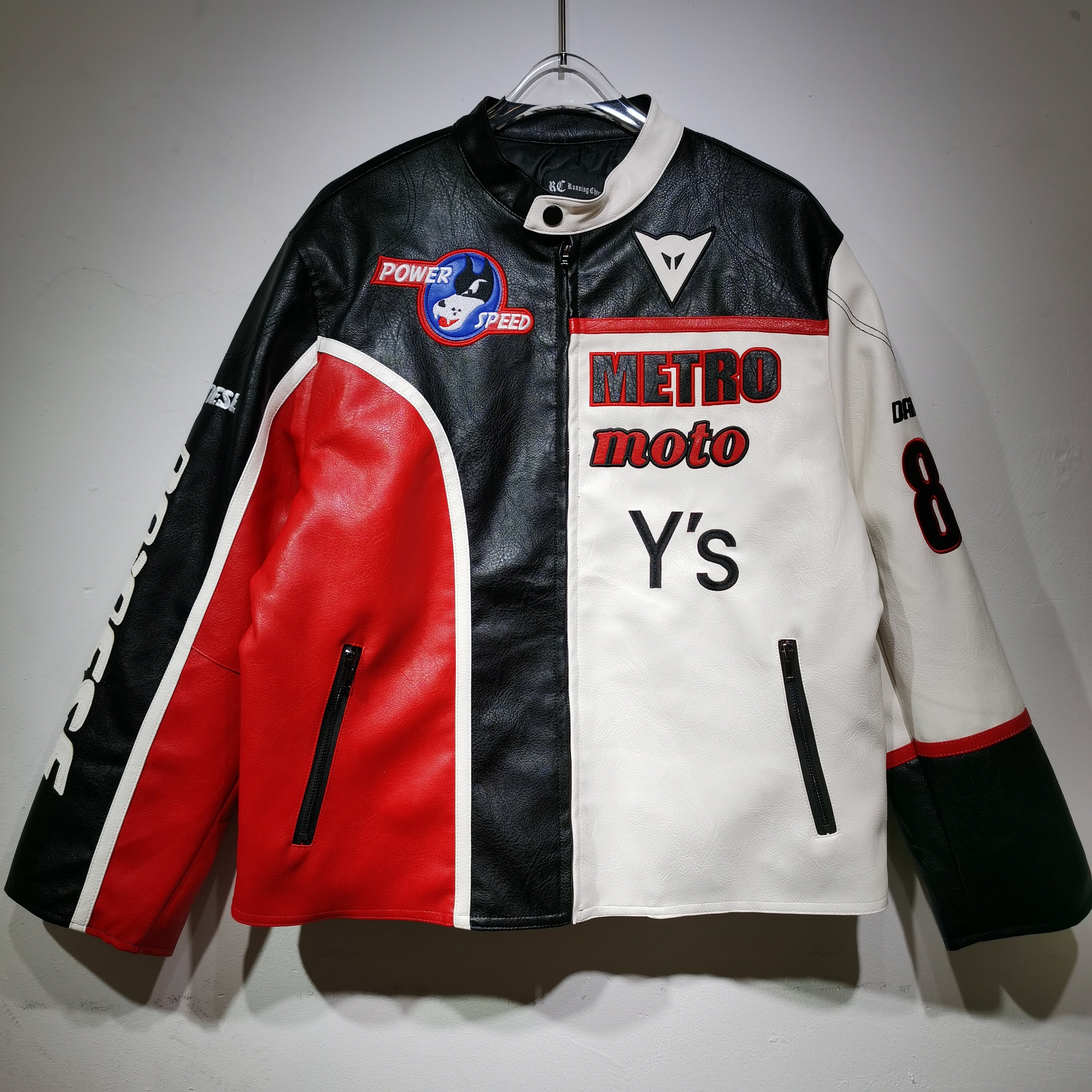 Multicolored jacket with 'Metro moto Y's' branding on a gray background