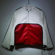 White jacket with red interior on a hanger against a gray background